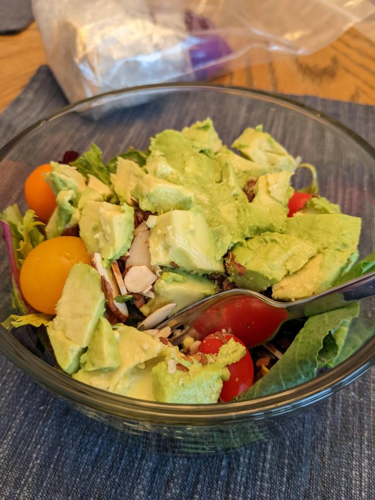 Lettuce with salsa and tomatoes and almonds