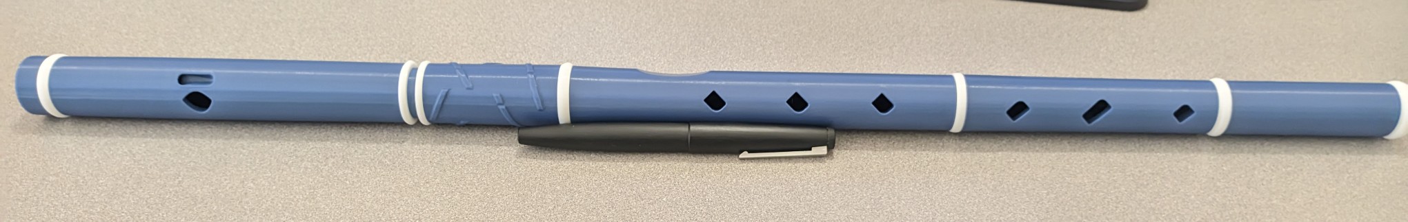 blue plastic flute with white accents